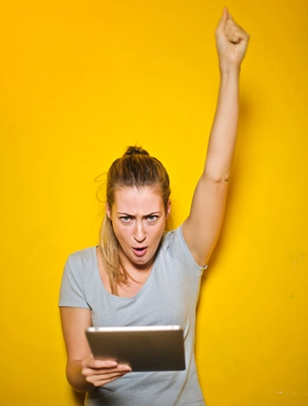 girl on tablet cheering