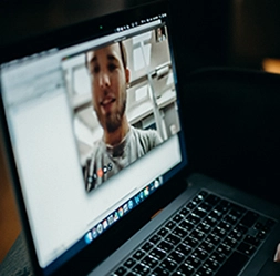 video chat with coworker on laptop